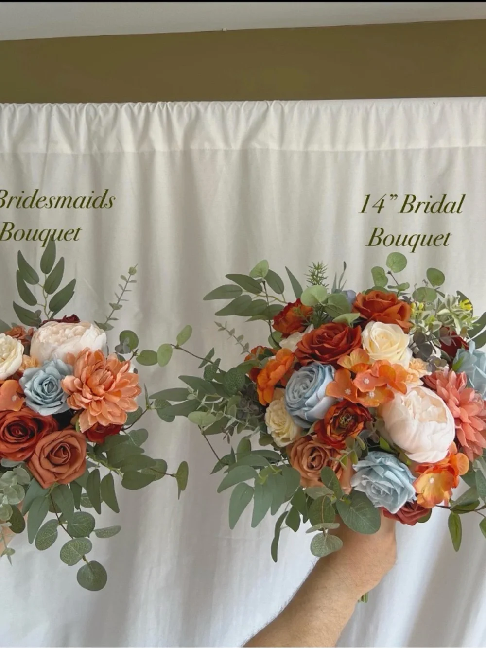 Faux bridal bouquets with rust orange, dusty blue, & eucalyptus.
